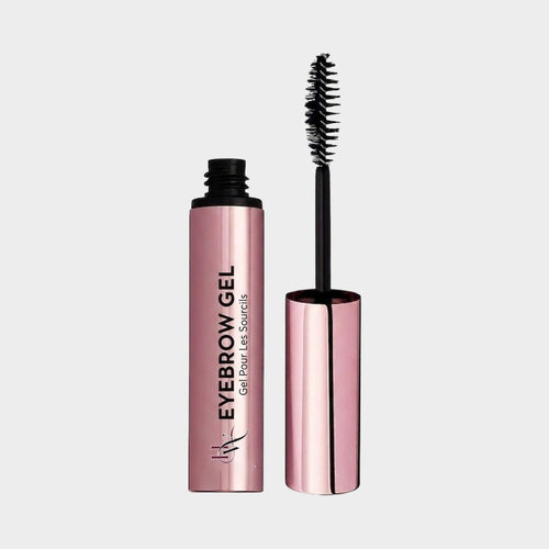 Eyebrow gel and brush on a light gray background